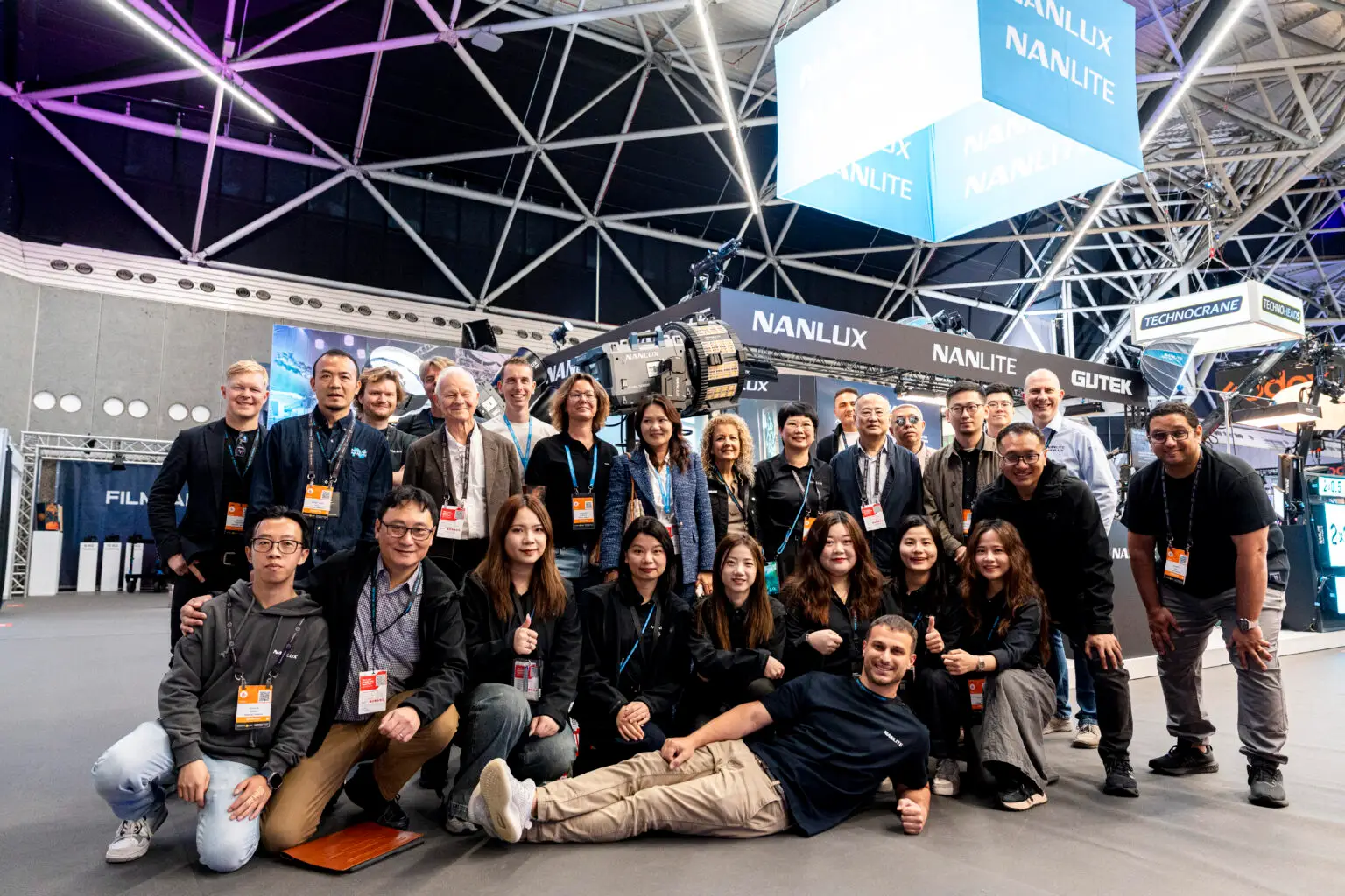 NANLITE team group portrait at the exhibition booth