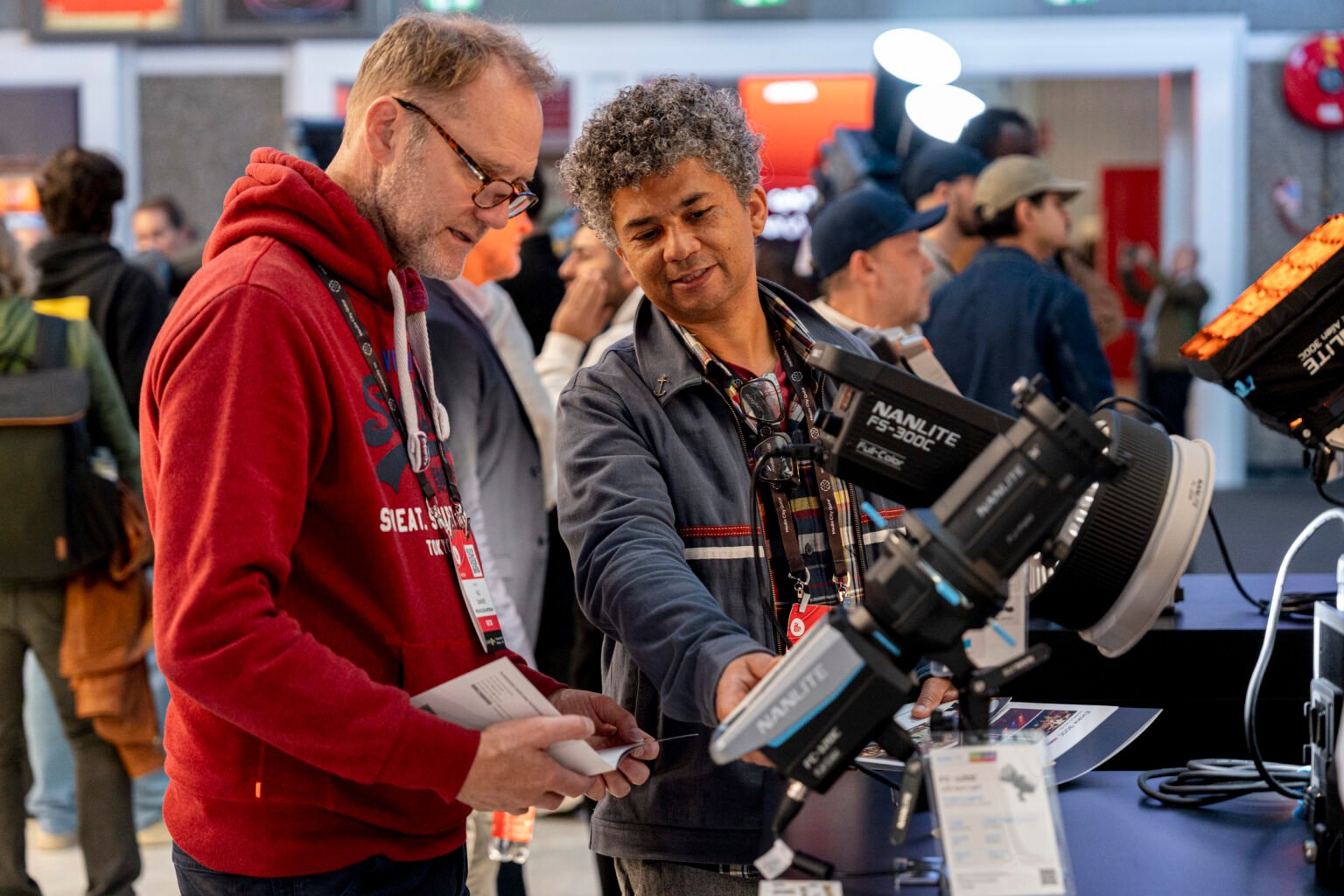 Attendees examining a NANLITE cinema light
