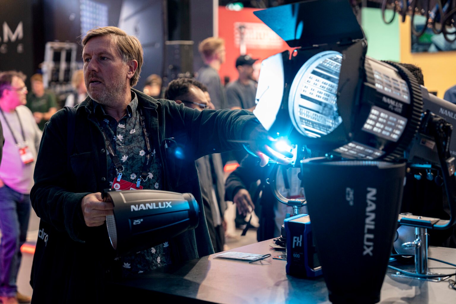 Presenter demonstrating an illuminated NANLITE fixture