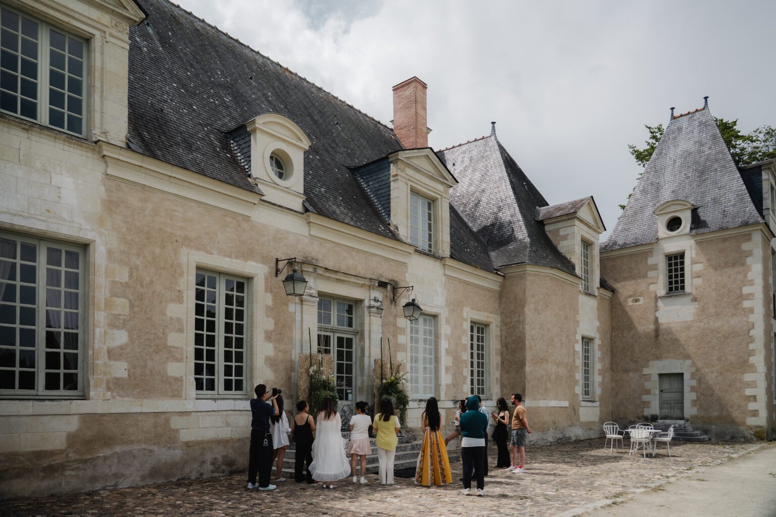 Floristry group gathered outside a French château